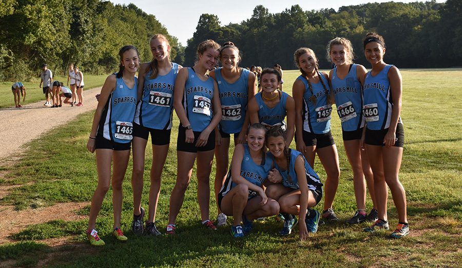 Varsity+girls%E2%80%99+cross+county+team+poses+for+a+picture+after+the+Providence+Invitational.+The+varsity+boys+and+girls+finished+third+overall%2C+and+the+JV+boys+finished+fifth+overall.+