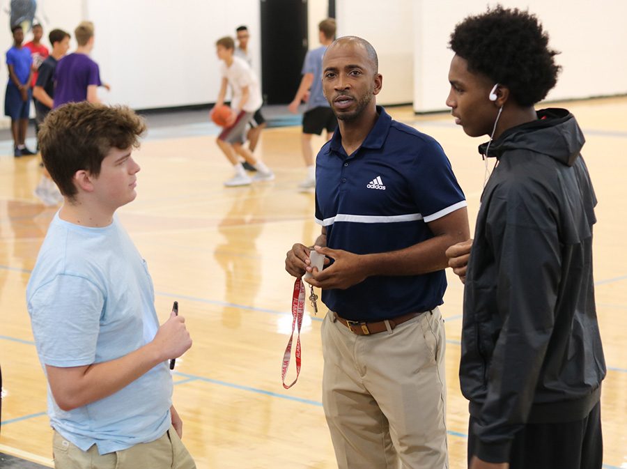 Editor-in-Chief Rilee Stapleton (left) interviews head basketball coach Charlemagne Gibbons (middle) and transfer Jamaine Mann (right). Mann, a 6’5” junior, previously played for Eagles Landing Christian Academy. The forward averaged 10.6 points and 7.8 rebounds as a sophomore last year.