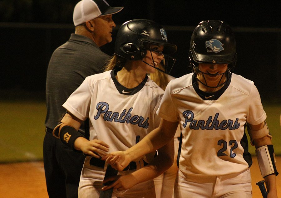Junior first baseman Paige Andrews and freshman pitcher Lilli Backes walk off the field together smiling. After defeating McIntosh, the Lady Panthers hold the No. 1 seed in region 3-AAAAA with a 16-1 overall record and 8-0 in the region. Starr’s Mill has only allowed one run in region play this season.