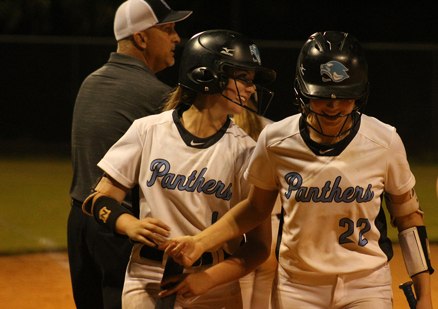 Junior first baseman Paige Andrews and freshman pitcher Lilli Backes walk off the field together smiling. After defeating McIntosh, the Lady Panthers hold the No. 1 seed in region 3-AAAAA with a 16-1 overall record and 8-0 in the region. Starr’s Mill has only allowed one run in region play this season.