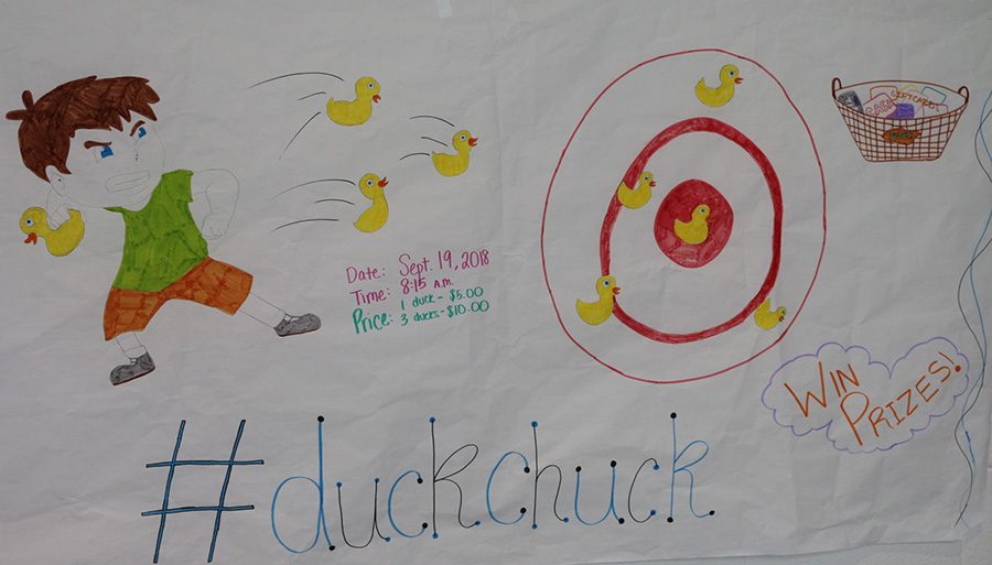 The entrepreneurship class is selling rubber ducks for students to throw at a target and win prizes. The class holds several events throughout the year to have hands-on experience about the materials taught in class.