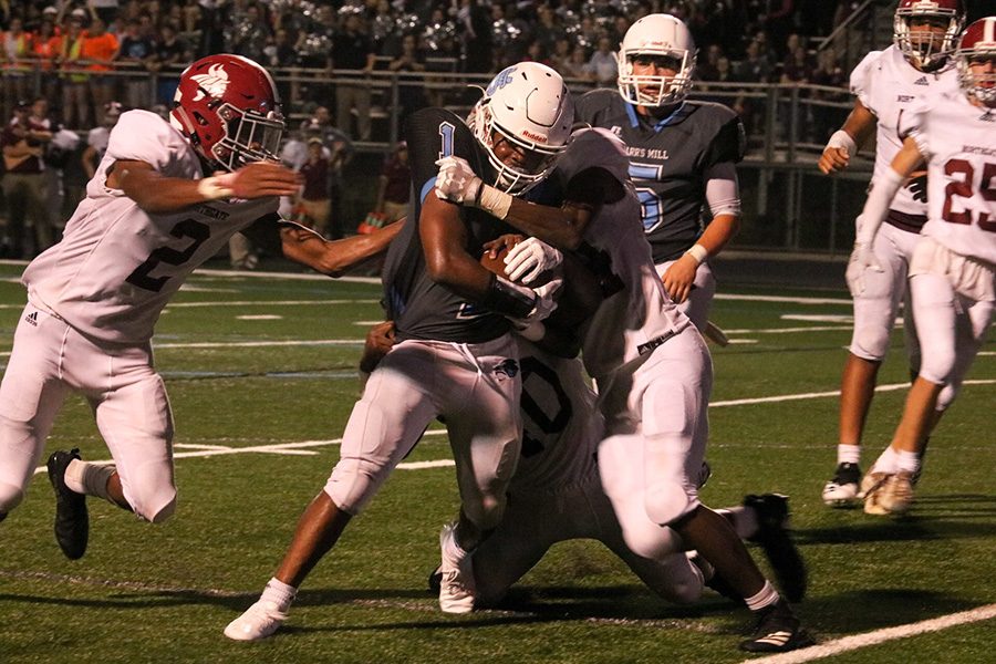 Junior running back Kalen Sims fights through Northgate defenders. Sims has already racked up 600 yards this season and has carried the Starr’s Mill offense through their first four games. 