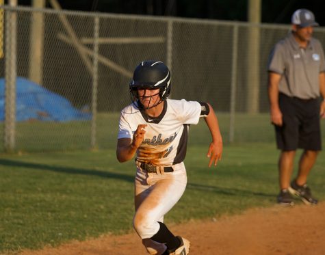 Sophomore Lauren Flanders heads home from third base. Flanders displayed aggressive baserunning, helping the team to its eighth straight win.