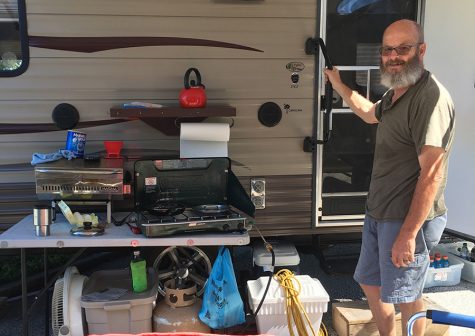 Myrtle Beach evacuee Robert Born poses by his grill that accompanied him to the trailers set up in Atlanta Motor Speedway. Cookouts used by the grill helped many of the evacuees feel at home during a trying time that forced them to evacuate.