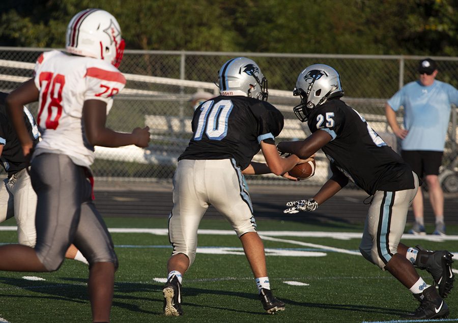 Freshman quarterback Colin Bartek hands the ball off to freshman running back Juleus Holborough. Starr’s Mill made running a priority, but were unable to gain significant yardage. The Panthers were also unable to pass the ball efficiently, frequently throwing incomplete passes.