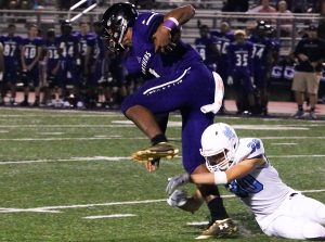 Senior Chapel Hill quarterback KJ Burton breaks off a tackle attempt from senior Grayson Faircloth. Chapel Hill rushed for 428 yards and six touchdowns against Starr’s Mill. Four different Chapel Hill players ran for a touchdown.