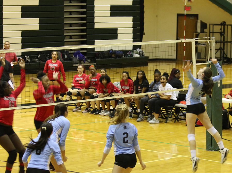 Senior Kaylee Leachman prepares to spike the ball against Jonesboro. The Panthers were able to score without difficulty in round one. Starr’s Mill beat the Cardinals in two games, with scores of 25-5 and 25-2.