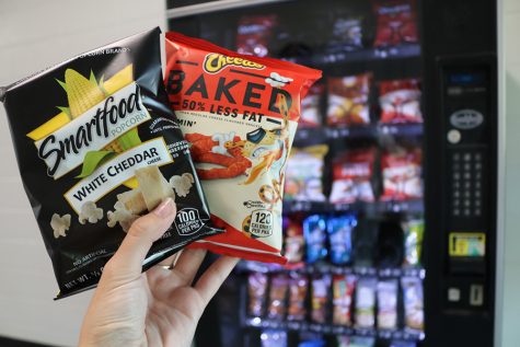 Student stands in front of the vending machine holding a “healthy” option of popcorn and “healthier” version of cheetos. The problem with the failed diets and regimens are actually the carbohydrates and everything they do to the body. 