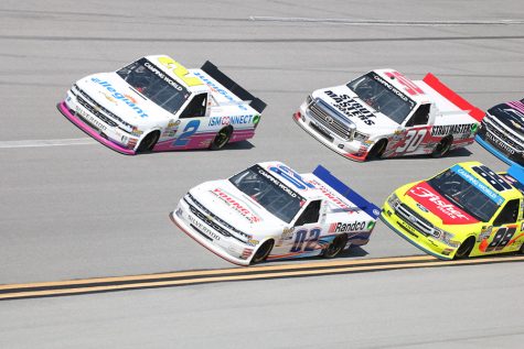 Austin Hill, driver of No.02  Young’s Building Systems/Randco Chevrolet, races near the front of the pack early in the Fr8Auctions 250. At Talladega, restrictor plates are added to the engines to level the playing field, which allows smaller teams to have a chance to win the race. “Since everyone’s drafting, everyone’s running restrictor plates, it equalizes the field, and it’s really anybody’s race,” Hill said.