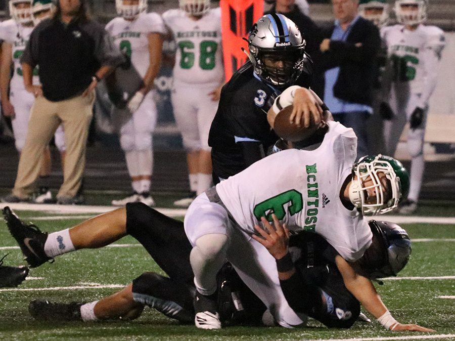 Sophomore Cole Bishop brings down senior Dane Kinamon. The Panther defense held McIntosh to 225 total yards, while Mill’s the offense accumulated 336 yards. Junior running back Kalen Sims rushed for 118 yards and a touchdown, increasing his season totals to 1,239 yards and 13 touchdowns.