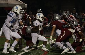 Junior running back Kalen Sims runs the ball against Whitewater. Sims had another tremendous game, totaling 279 rushing yards and three touchdowns in the 49-14 win.