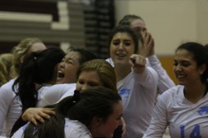 Senior Lauren Ratinaud points to the camera as the rest of the team celebrates around her. Starr’s Mill came back from an 0-2 deficit to win the match against Whitewater 3-2, avenge the team’s loss in the region tournament a couple of weeks ago, and give them a spot in the AAAAA GHSA state championship.