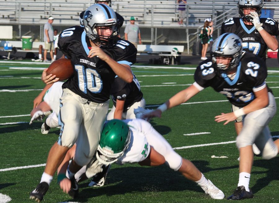 Freshman quarterback Colin Bartek breaks away from a Chief blitz. Bartek ended the game with two touchdowns and 117 total yards.