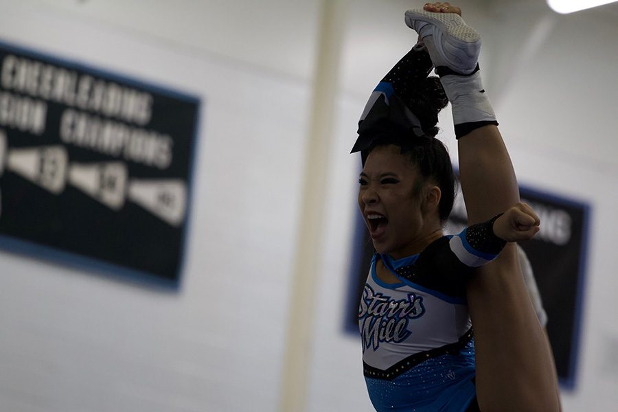 Starr’s Mill cheer flyer stands tall with her leg in the air. The team competed last weekend at Starr’s Mill, but chose to remove itself from scoring.