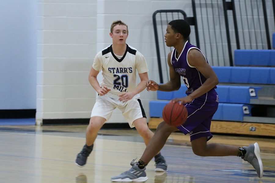 Junior shooting guard Wes Grant guards the ball. Starr’s Mill played well on the defensive end, defending the perimeter efficiently. However, foul trouble in the paint cost the Panthers several defensive stops.