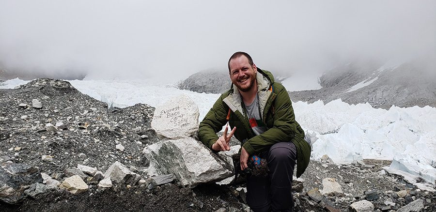 Former Panther Danny Herres poses at the Mount Everest Base Camp in Nepal last June. Since graduating from the Mill in 2000, Herres has been living overseas, teaching, and experiencing world cultures.
