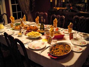 Table set up for Thanksgiving with all of the tempting holiday foods. With Thanksgiving and Christmas around the corner there will be many distractions to your goals, but there are five things that can help prevent that.