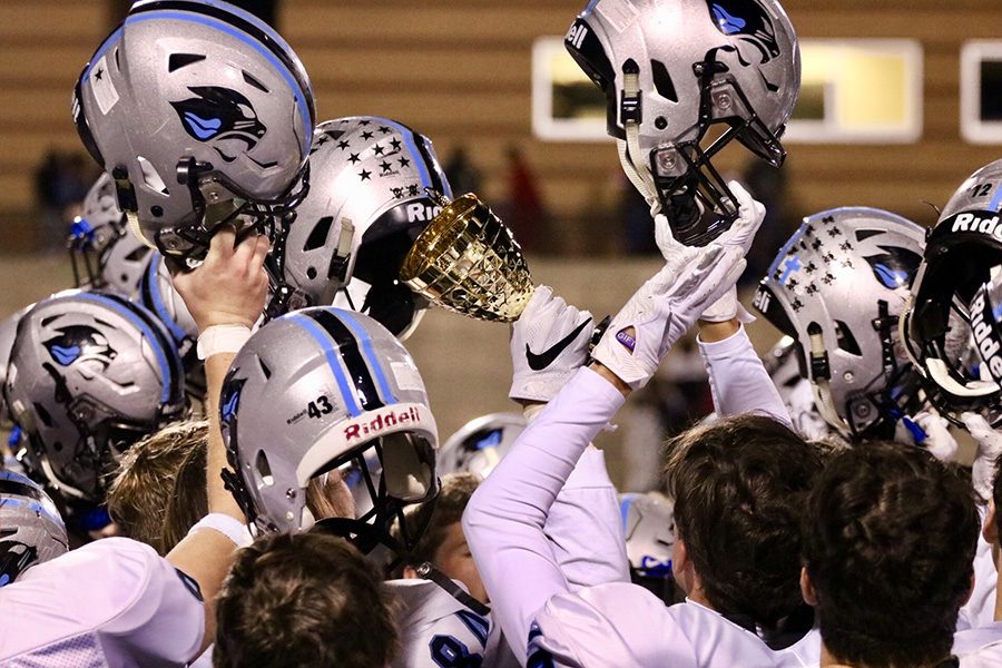 The Panthers hold up their region championship trophy. Starr’s Mill defeated Fayette County 27-0 to cap off a 6-0 region record and win their third straight region title. 