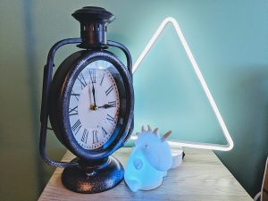 I like to keep a very loud analog clock and a color-changing unicorn in my room to help supply background stimulus so I can stay focused on things I actually need to do. 