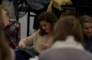 Junior Anna Samson participates in the first read through for the spring musical “Back to the ‘80s.” Samson will play the role of Ms. Brannigan.