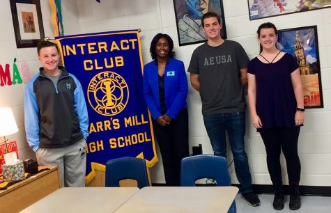 Interact Club Guest Speaker Darlene Drew poses with the Interact Club President Caleb Warnock, and club members Ashley Osborne and Thomas Cummings. Drew led the meeting with a speech about making choices, and personal anecdotes of her job as a warden. 