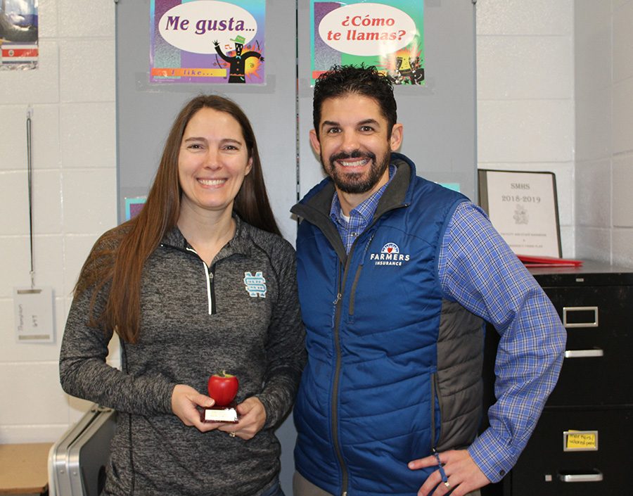 Tim Monihan from Farmers Insurance in Peachtree City poses with this month’s Golden Apple winner Spanish teacher Shayne Thompson. Thompson believes that “where there’s a will, there’s a way,” and she demonstrates this way of thinking to her students as they learn a world language. 