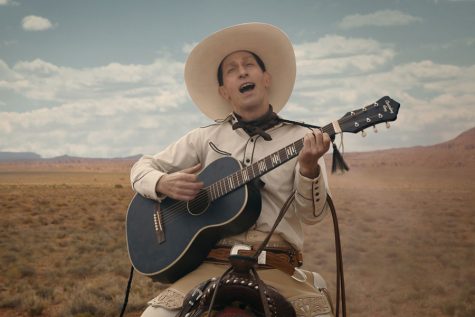 Eccentric cowboy Buster Scruggs rides through the desert, singing a tune on horseback. Scruggs’ story is one of six in the anthology western film “The Ballad of Buster Scruggs,” a magnificent portrayal of the Old West created by the Coen Brothers.
