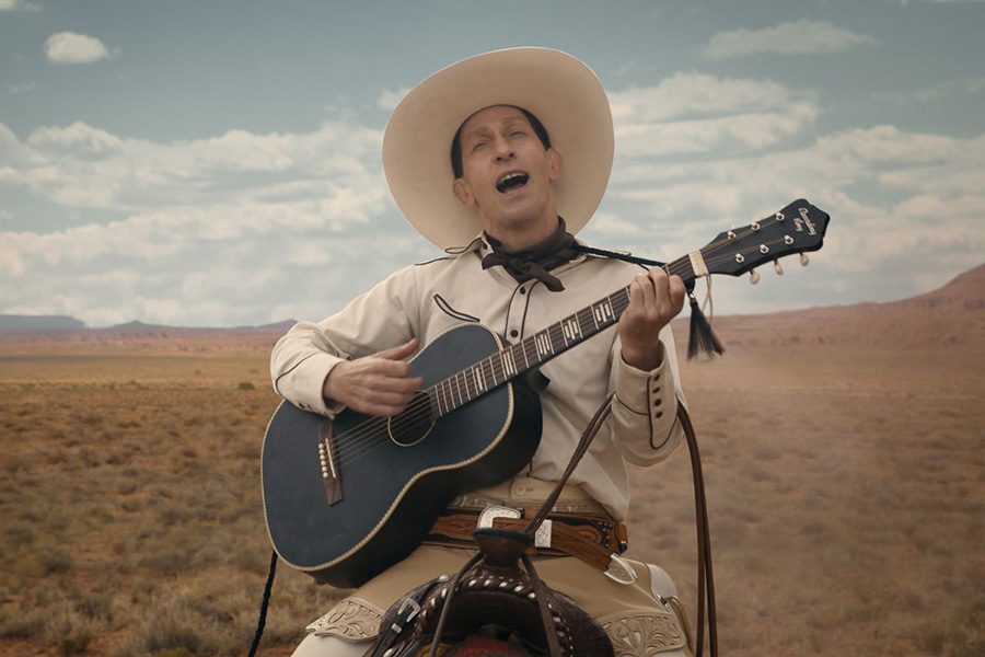 Eccentric+cowboy+Buster+Scruggs+rides+through+the+desert%2C+singing+a+tune+on+horseback.+Scruggs%E2%80%99+story+is+one+of+six+in+the+anthology+western+film+%E2%80%9CThe+Ballad+of+Buster+Scruggs%2C%E2%80%9D+a+magnificent+portrayal+of+the+Old+West+created+by+the+Coen+Brothers.