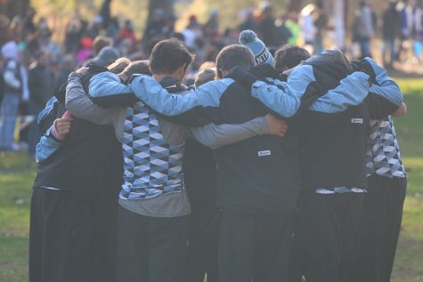 The Starr’s Mill cross country team huddles before the Meet of Champions. The team was invited to the meet one week after winning the GHSA State Championship. 