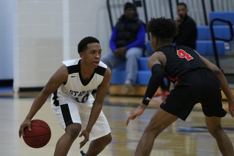 Junior guard Darryl Rice being guarded by junior Cardinal Jared Rogers. The duo of senior Nate Allison and junior Jamaine Mann combined for 30 points against Jonesboro, but it wasn’t enough as the Cardinals won 58-55.