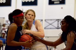 Freshman Panther Jaclyn Hester fights for possession. Hester scored 13 points and junior Alice Anne Hudson added 16, but the Lady Panthers still fell to Sandy Creek 48-45.