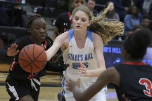 Freshman Jaclyn Hester fights for the ball against Jonesboro. Hester finished the game with 10 rebounds, and she made a clutch shot to send the game to overtime. In the extra period, the Lady Panthers pulled out a 54-51 win to improve to 3-0 in the region.