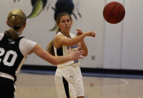 Sophomore Lauren Flanders passes the ball to a nearby teammate. The JV Lady Panthers took the win over the Lady Chiefs 32-13 despite many turnovers from both teams. However, the Starr’s Mill defense was enough to keep McIntosh off its game.