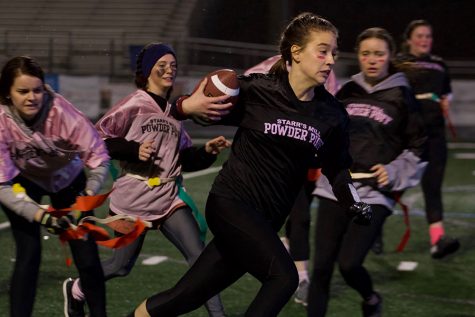 Senior Shelby Foster pulls the flags off of junior Miyah Hunter. The class of 2019 played the class of 2020 in the Starr’s Mill Powderpuff game for Promise Place. The game raised over $2000 for Promise Place.