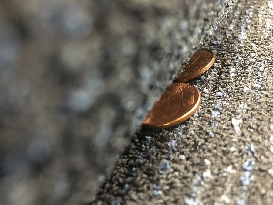 The pennies being swallowed by the couch represents the issue of one’s thoughts being oppressed with the desire to keep the peace at a time when discussion may be imperative. No matter how out there a thought or opinion may be, it must be shared if the desire is there. 