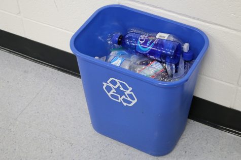 Recyclable items fill a blue recycling bin. The ecology club is bringing back recycling bins to every teacher’s classroom after two years without the opportunity to recycle. 