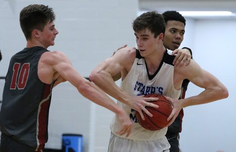 Senior Nate Allison grabs a rebound. Allison was active on the boards against Whitewater, snatching 13 rebounds. The Panthers’ ability to rebound played a key role in their 46-34 win. 