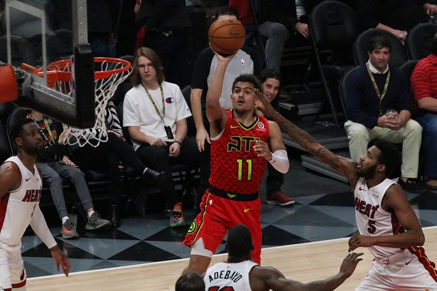 Rookie guard Trae Young shoots a floater against the Miami Heat. Young is leading Atlanta through their rebuild, as they prepare for a future that could be brighter than most think. 