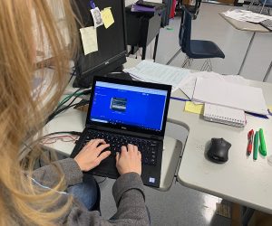 History teacher Susan King listens to a movie soundtrack on her computer while working. King, like other teachers, has a music taste students might not expect.