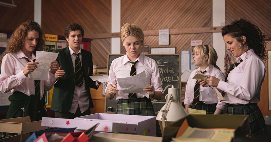The Derry Girls in action. Erin (Saoirse-Monica Jackson), accompanied by friends Orla (Louisa Harland), James (Dylan Llewellyn), Clare (Nicola Coughlan), and Michelle (Jamie-Lee O’Donnell), address a dilemma facing the school newspaper.