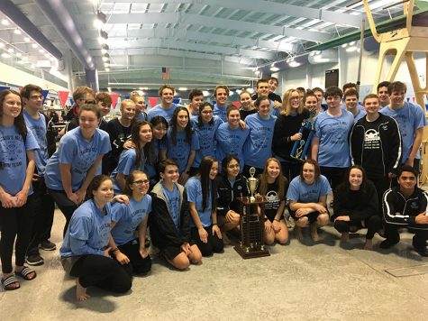 The swim team poses with the County Championship trophy to celebrate the 19th straight win. Starr’s Mill ended the event with 734 points. McIntosh High School finished second with 613. Whitewater accumulated 423 points to finish third.