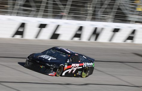 Georgia native Garrett Smithley, driver of the No. 77 Overkill Motorsports Chevrolet, passes the Atlanta writing in Turn 4. Smithley finished the race at his home track in 36th place and 71 laps behind race winner Brad Keselowski.