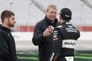 Aric Almirola, driver of the No. 10 Smithfield Ford, fist bumps one of his crew members after earning the pole for Sunday’s Folds of Honor QuikTrip 500. During round three of “knockout” qualifying, Almirola overcame placing second and third in the two previous rounds to land himself the top spot. 
