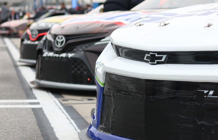 Monster Energy NASCAR Cup Series cars ined up on pit road prior to qualifying for the Folds of Honor QuikTrip 500. 