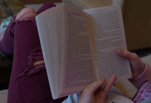 A student enjoys one of their books during a period of downtime. Everyone should be free to enjoy what they want during their freetime and should not be put down for their likes and dislikes. 