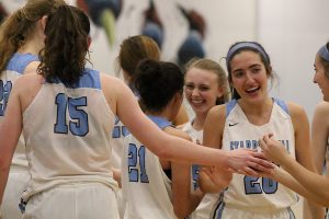 Junior Alice Anne Hudson high fives her teammates after their win over Ware County. Hudson scored 23 points and snagged seven steals in the 58-44 win. This is only the second time in school history a girls’ basketball team has advanced to the second round of the state playoffs.