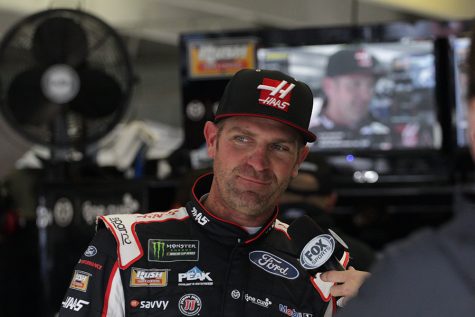 Clint Bowyer, driver of No. 14  Haas Automation Ford for Stewart Haas Racing, talks with FOX Sports in the garage. Bowyer paced the final Monster Energy NASCAR Cup Series practice with a speed of 179.104 mph. Bowyer also led the first practice and qualified third for the race.