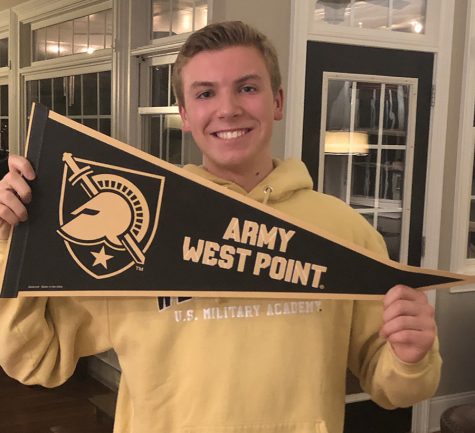 Rhett Perry holds up his West Point flag moments after receiving the news of his acceptance. Perry received a personal call from senator David Perdue to let him know that he got in. 