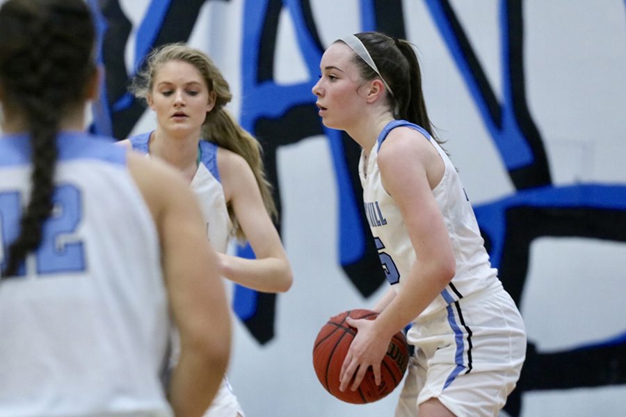 Junior Alice Anne Hudson scans the court for an open teammate. Hudson, a first team All-Region selection, senior Alyssa Angelo, and Region 3-AAAAA freshman of the year Jaclyn Hester have helped rebuild a girls’ basketball program that missed the state playoffs just two years ago.