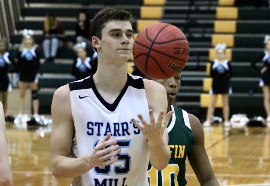 Senior Nate Allison tosses the ball in the air. Allison, who was recently named to the Region 3-AAAAA All-Region second team, finished with 18 points and 10 rebounds in the Mill’s 45-41 win over Griffin.